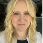 Close up headshot of Abbey Kish, light skin, blonde hair, and blue eyes smiling at the camera.