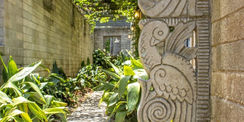 Image of the pathway leading into the Mayan Courtyard on A&H grounds.