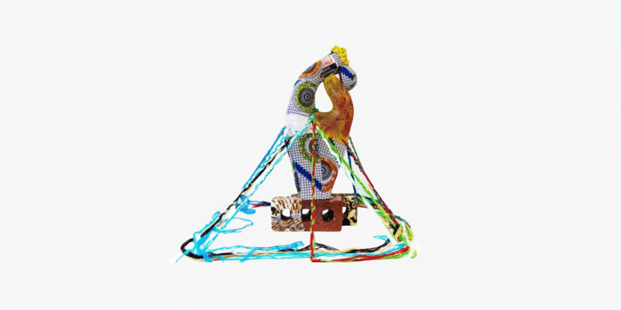 Image of colorful sculpture made with multiple mediums.