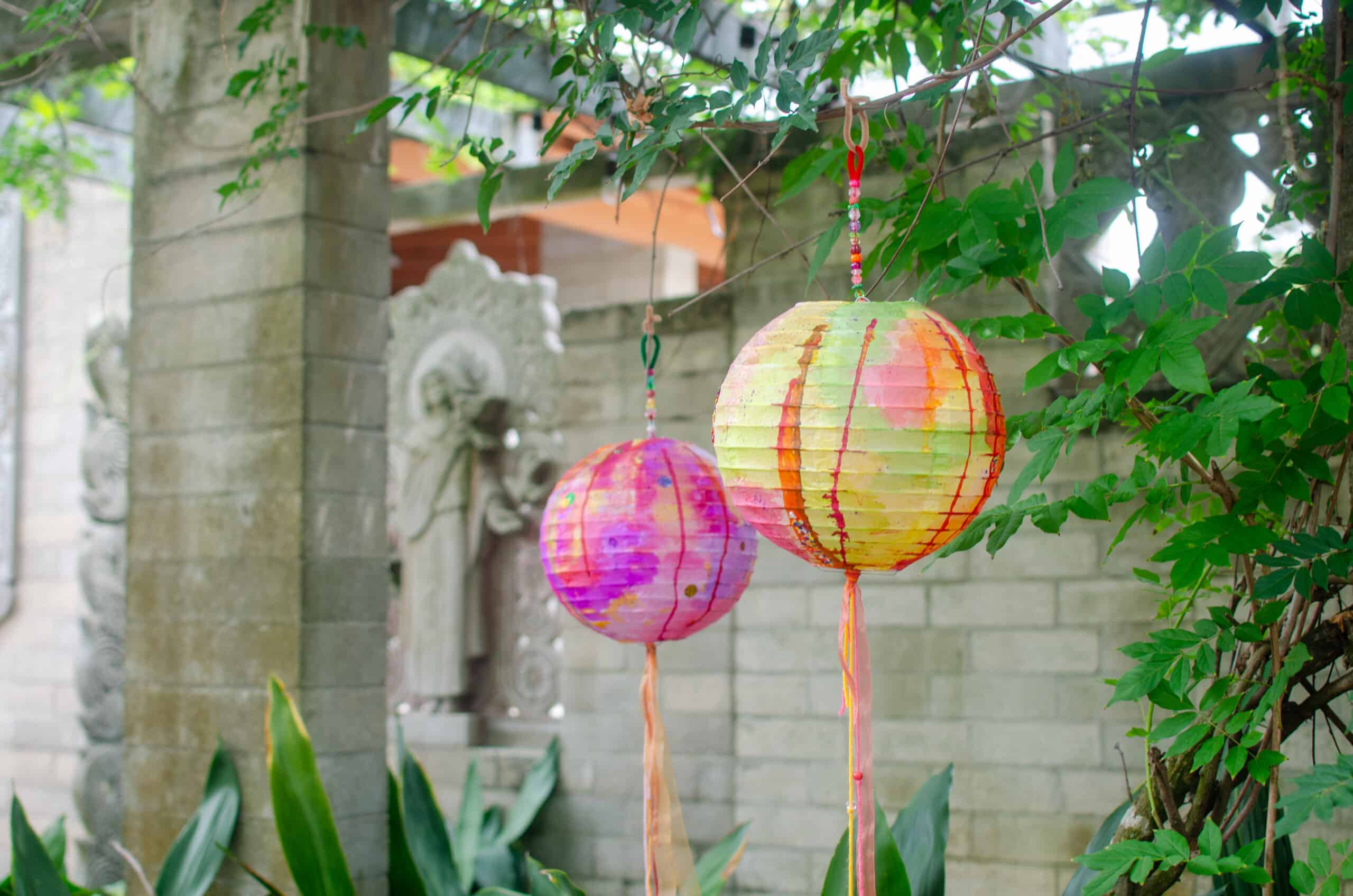 colorful handpainted paper lanterns hang in outdoor chapel at the museum