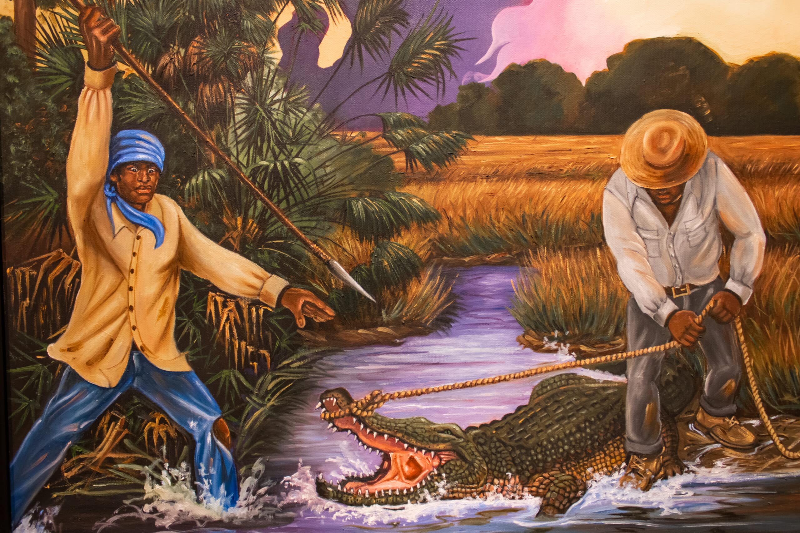 A vibrant painting of a Black Seminole with a spear about to strike an attacking alligator as another Black man in a straw hat restrains it with a rope.