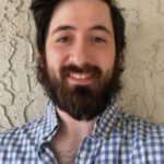 A headshot of Klaudio Xhindoli.